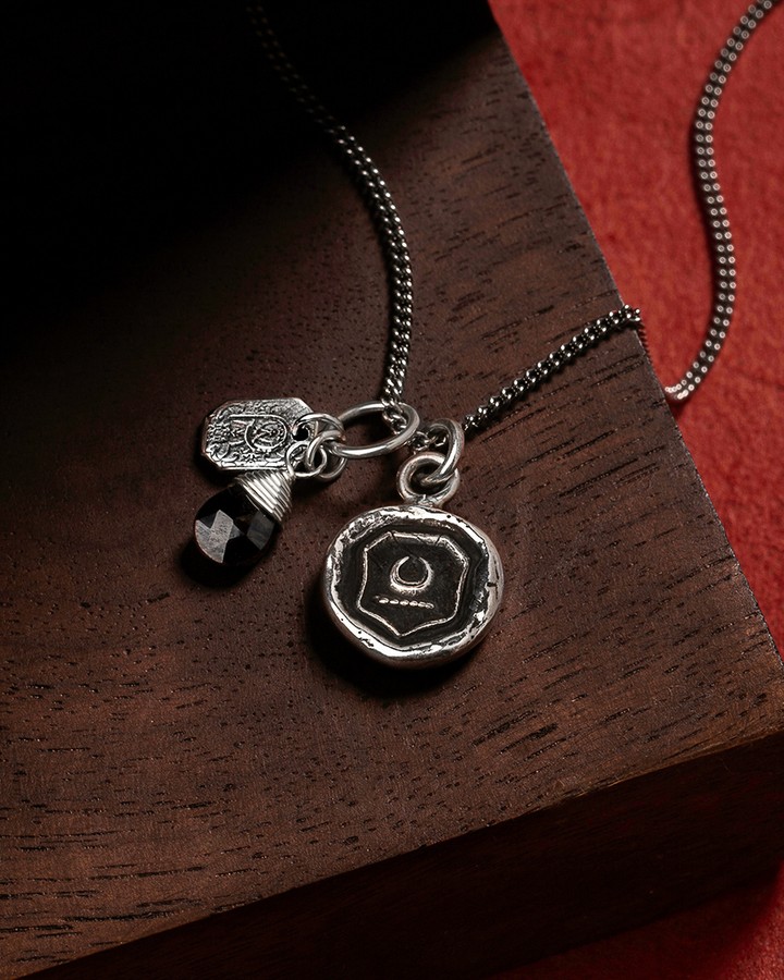 Sterling Silver stamped moon talisman from Pyrrha