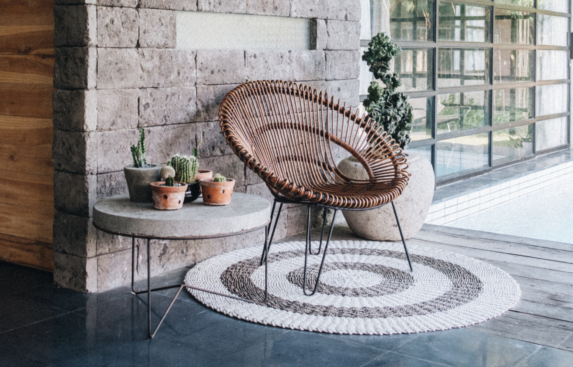 Boho Home Patio with a wood circle chair and succulents on a side table, for The Annex contact us banner